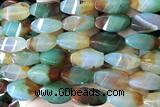 AGAT297 15 inches 10*20mm faceted twisted rice rainbow agate beads