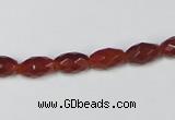 CAA124 15.5 inches 6*10mm faceted rice red agate gemstone beads