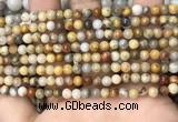 CAA4933 15.5 inches 4mm round yellow crazy lace agate beads wholesale