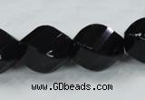 CAB338 15.5 inches 18*24mm faceted & twisted rice black agate beads