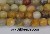 CAG9868 15.5 inches 4mm faceted round yellow crazy lace agate beads