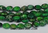 CDE178 15.5 inches 6*8mm oval dyed sea sediment jasper beads