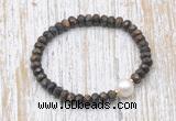 CFB754 faceted rondelle bronzite & potato white freshwater pearl stretchy bracelet