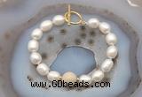 CFB968 Hand-knotted 9mm - 10mm rice white freshwater pearl & white fossil jasper bracelet