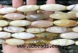 CRI143 15.5 inches 10*30mm faceted rice yellow opal gemstone beads