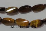 CTE1097 15.5 inches 8*15mm twisted & faceted oval yellow tiger eye beads